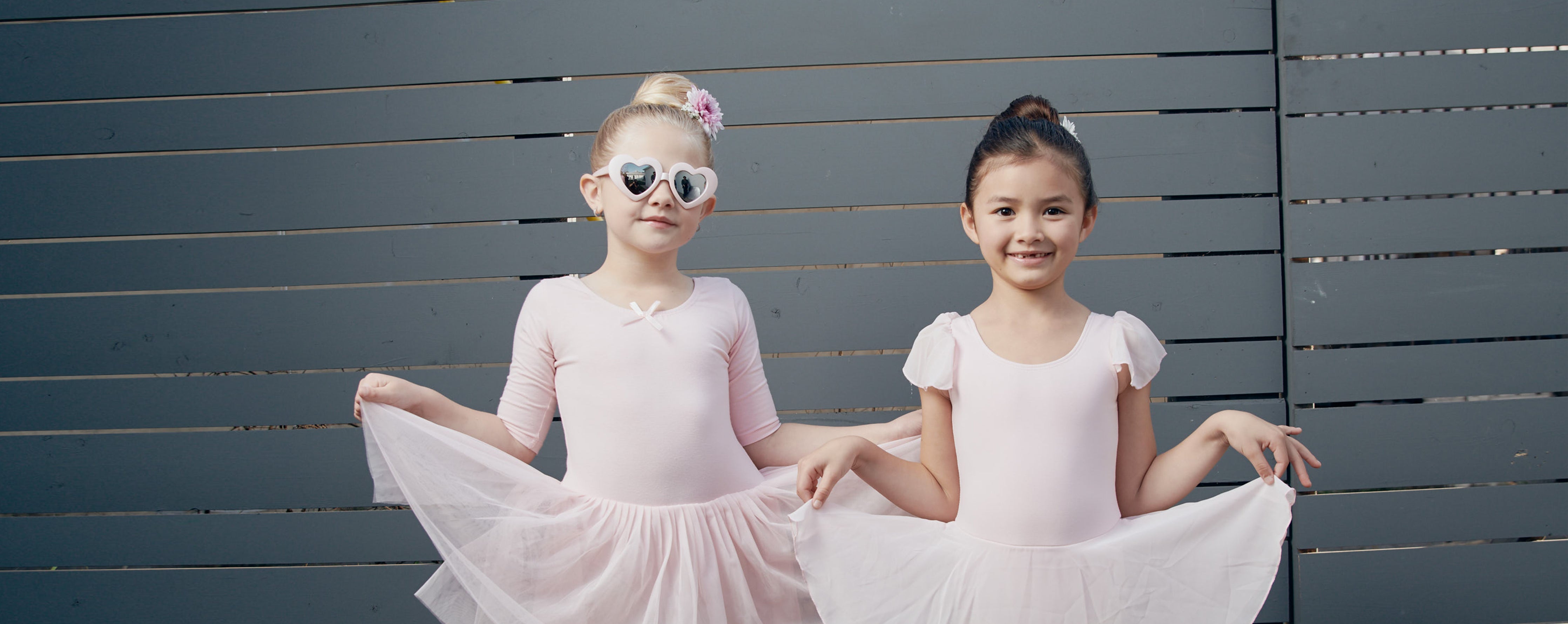 two girls wear ballet dress