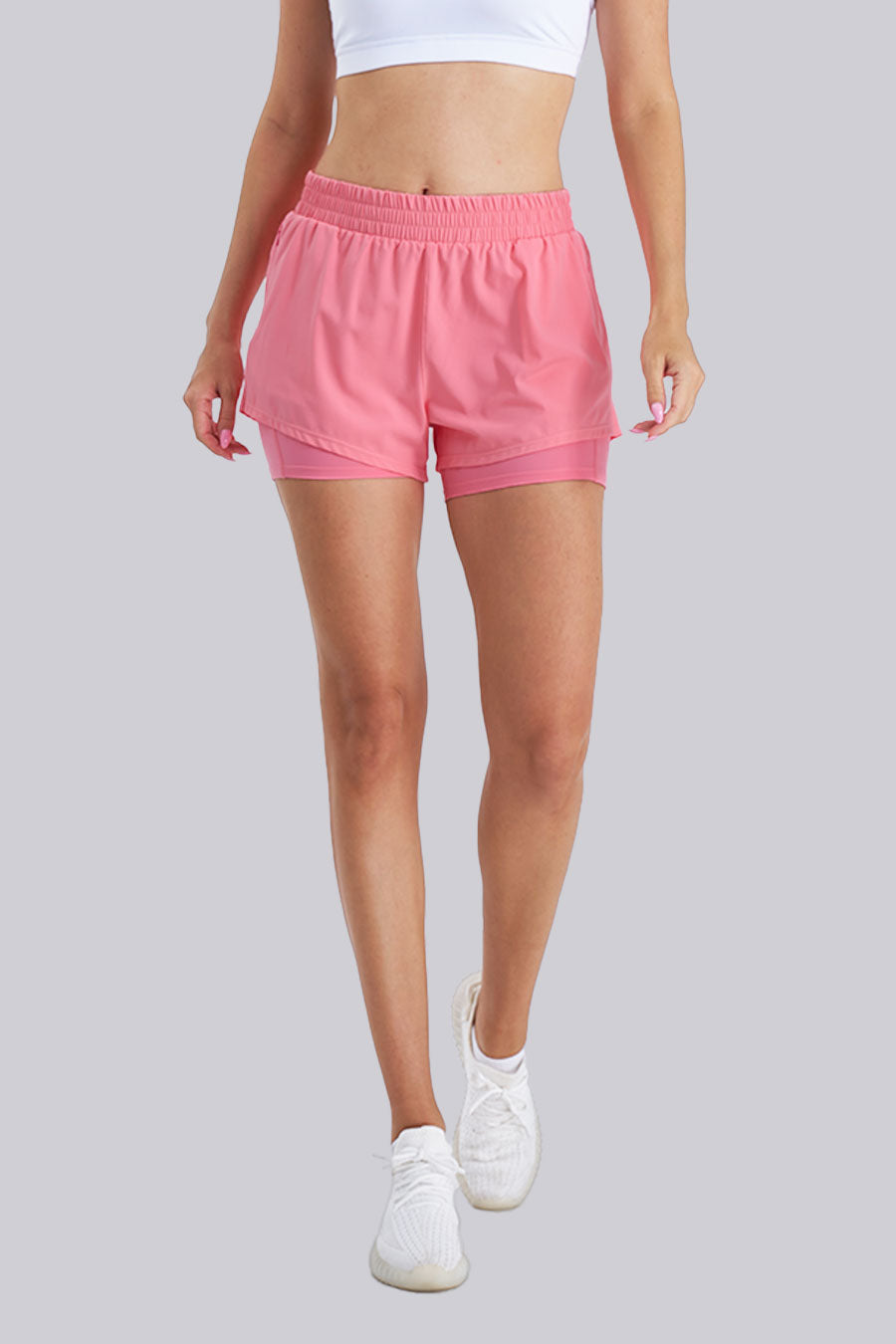 Pink high-waisted running shorts