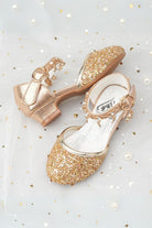 Gold sparkly mary jane shoes top view