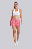 Women wearing pink high-waisted shorts