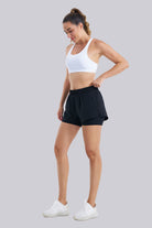 Women wearing black running shorts