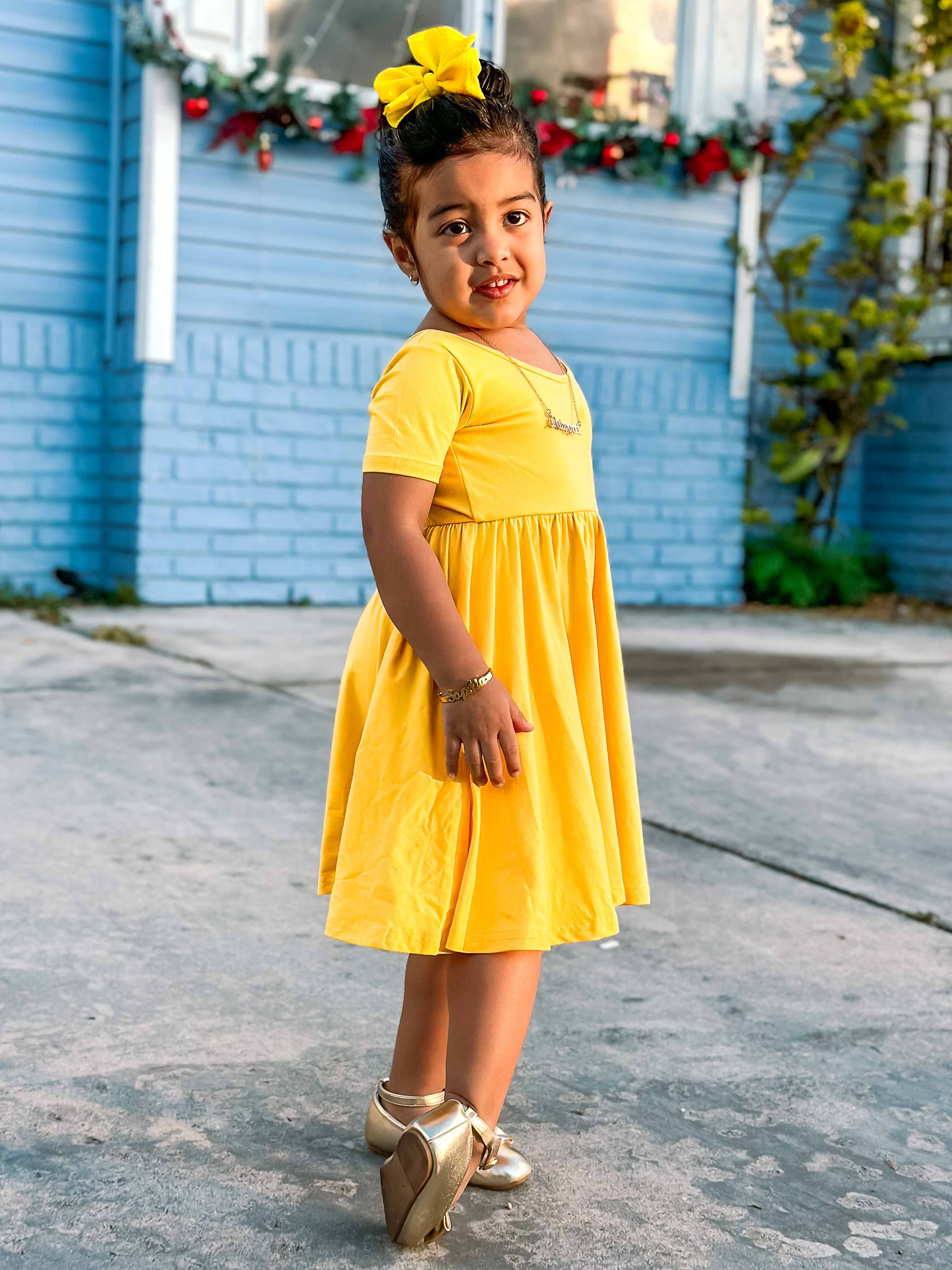 Yellow short sleeve dress detail shot