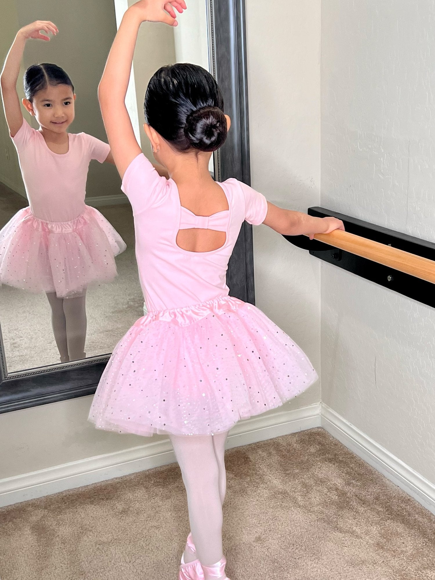 Pink full-body leotards for toddlers