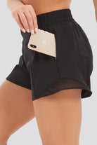 running shorts women black side view